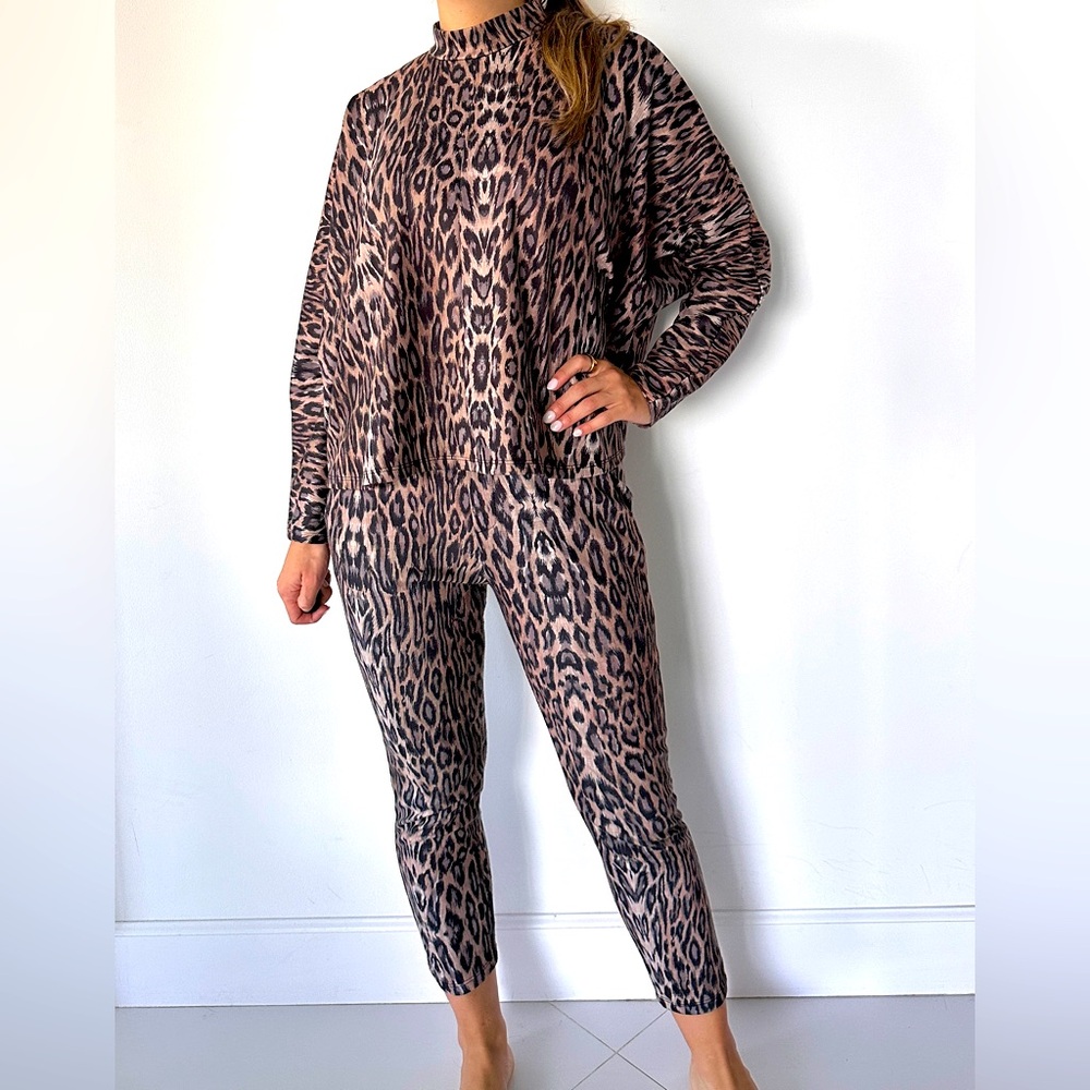 Leopard print sweatpants and sweatshirt set.